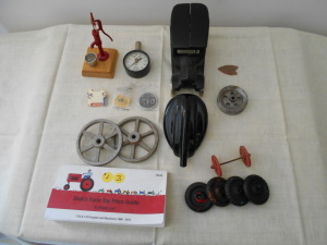 INTERNATIONAL TIRE GAUGE, PENDANTS, DIE CAST WHEELS, WATER PUMP, RED WHEEL SET, 4 BLK WHEELS, GAS CAP, PICKS FARM TOY BOOK, OLD CAR