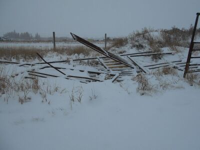 SCRAP PILES OF BENT GATES, PANELS, ETC.